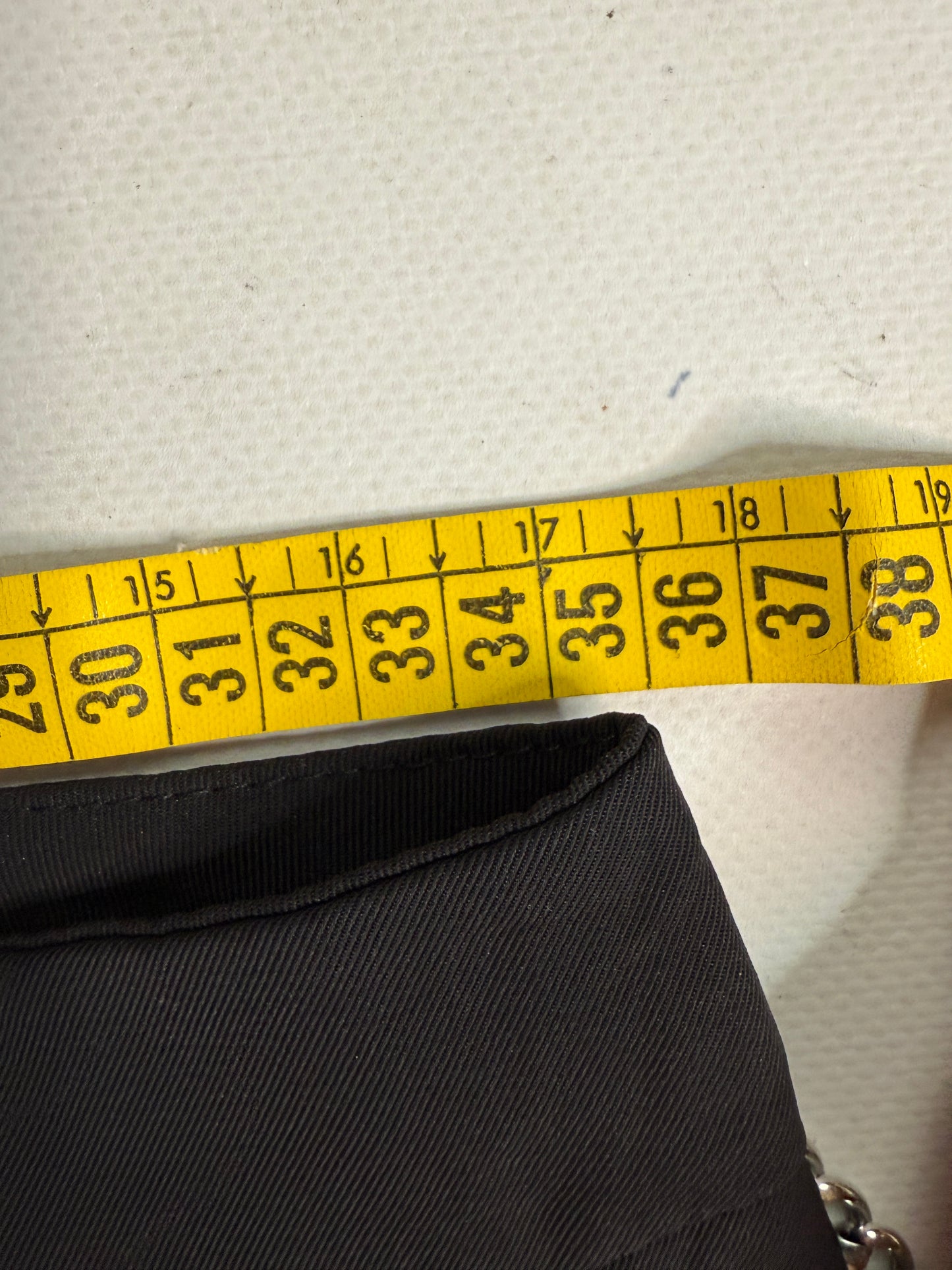 Black office siren mini skirt with chain details