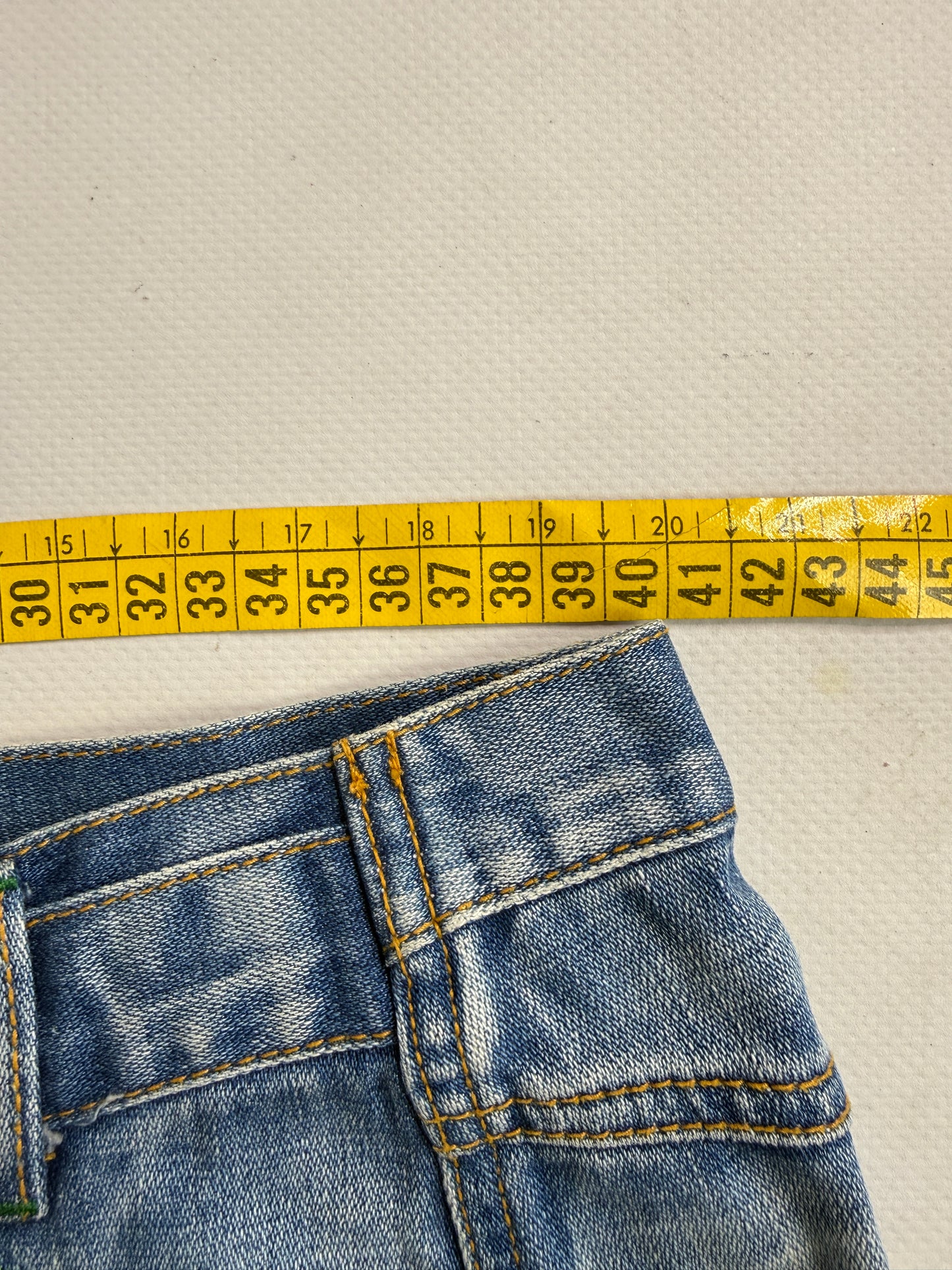 2000s graphic denim mini skirt