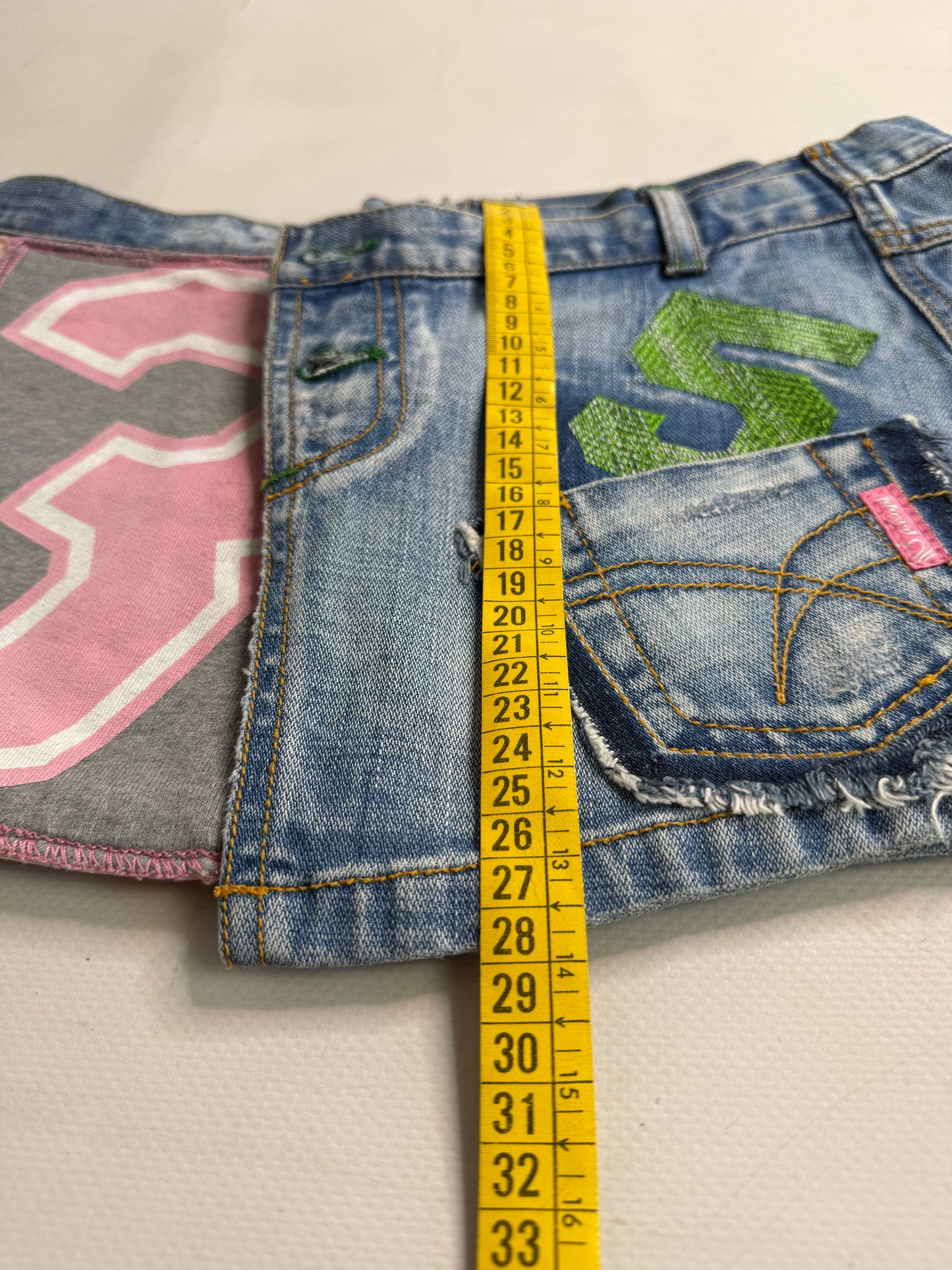2000s graphic denim mini skirt